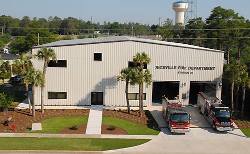 Aerial image of new fire station with two engines in bays